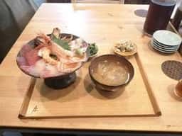 ま