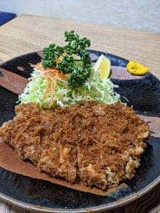 かつ善