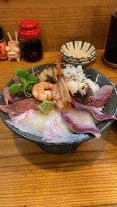ま
