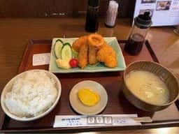 よってけまるとみ